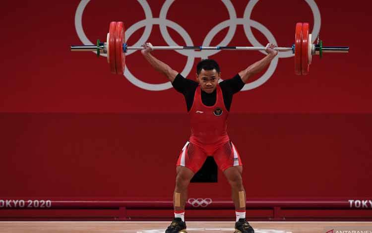 Lifter Eko Yuli menyumbang medali emas untuk Indonesia di Olimpiade Tokyo, Minggu 25 Juli 2021. (Int)